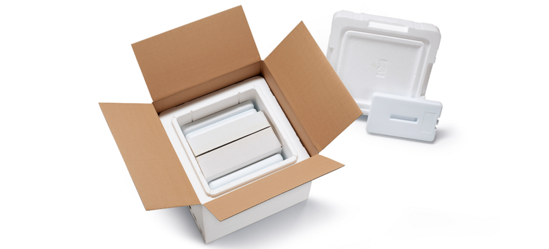 A cardboard box with a white insulated box and a further inner carton and cooling elements 